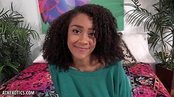 Play The black teenager has big tits and sits naked in front of the camera